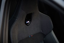 BMW M135 (2024) review: front sports seat, black fabric upholstery