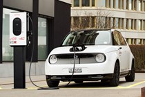 Image of Honda e plugged into an EV charger