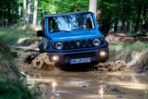 Suzuki Jimny review - front view, blue, off-road, fording muddy river