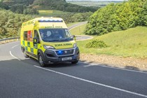 Image of a Fiat Ducato ambulance driving with lights flashing