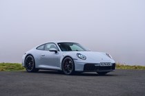 Image of a grey Porsche 911 GTS, front right three-quarters view