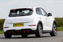 GWM Ora 03 review, white, dynamic, cornering, rear three quarters | Parkers