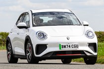 GWM Ora 03 review, white, dynamic, cornering, front three quarters | Parkers