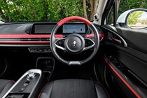GWM Ora 03 review, interior, black, red, dashboard, steering wheel | Parkers