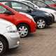 Line-up of a variety of used cars on a dealer's forecourt