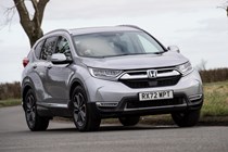 Honda CR-V (2023) review: front cornering showing body roll, silver paint