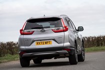 Honda CR-V (2023) review: rear cornering showing body roll, silver paint