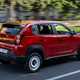 Fiat Panda (2025) review: rear three quarter driving, red paint