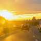 Image of traffic on a motorway under bright sunlight