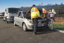 Image of a breakdown patrol attending a Renault Scenic, with the car's driver and children looking on