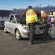 Image of a breakdown patrol attending a Renault Scenic, with the car's driver and children looking on