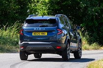 Dacia Bigster (2025) review: rear three quarter driving, blue paint