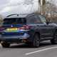 BMW X3 review (2023): rear three quarter cornering shot, blue car, rural background
