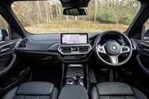 BMW X3 review (2023): dashboard and infotainment system, black upholstery