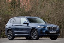 BMW X3 review (2023): front three quarter static, blue car, wooded background