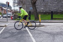 Image of a cyclist passing a traffic island