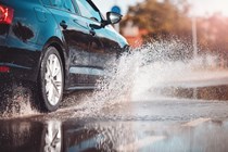 Image of a Volkswagen Jetta driving through a deep puddle