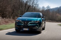 Alfa Romeo Junior Ibrida (2025) review: front three quarter cornering, blue paint