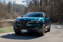 Alfa Romeo Junior Ibrida (2025) review: front three quarter driving, blue paint