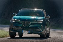 Alfa Romeo Junior Ibrida (2025) review: front three quarter cornering, blue paint