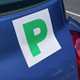 Close-up image of a green P plate on the back of a Nissan Micra