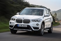 BMW X1 SUV in white on German plates driving