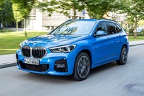 Blue 2019 BMW X1 SUV front three-quarter driving