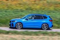 Blue 2019 BMW X1 SUV side elevation driving