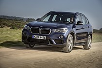 BMW X1 SUV in blue on German plates driving