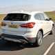 BMW X1 SUV '15 plate in white driving