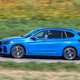 Blue 2019 BMW X1 SUV side elevation driving