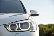 BMW X1 SUV (2015-) in white front headlight
