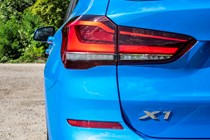 Blue 2019 BMW X1 SUV rear light unit and badge