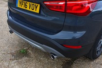 BMW 2016 X1 SUV Exterior detail rear quarter, bumper and exhaust
