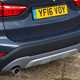 BMW 2016 X1 SUV Exterior detail - lower tailgate and exhausts