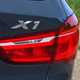 BMW 2016 X1 SUV Exterior detail - badge and rear light cluster