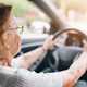 Image of an elderly woman driving a car