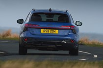 Audi A6 Avant review - rear, blue, driving round corner