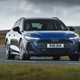 Audi A6 Avant review - front, blue, driving round corner
