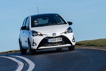 White 2019 Toyota Yaris front three-quarter driving