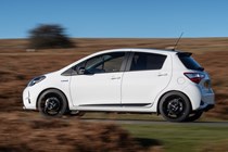 White 2019 Toyota Yaris side elevation driving