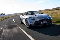 Aston Martin Vanquish Volante review - front, silver, driving round corner
