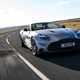 Aston Martin Vanquish Volante review - front, silver, driving round corner