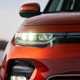 Kia Soul EV (2023): LED headlamp close-up, orange paint