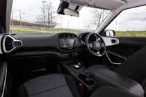 Kia Soul EV (2023): front seats and dashboard, black fabric upholstery