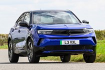 Vauxhall Mokka Electric review, driving, blue, front three quarters | Parkers
