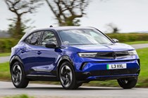 Vauxhall Mokka Electric review, driving, blue, front three quarters | Parkers