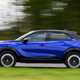 Vauxhall Mokka Electric review, driving, blue, side | Parkers