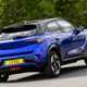 Vauxhall Mokka Electric review, driving, blue, rear three quarters | Parkers