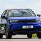 Vauxhall Mokka Electric review, driving, blue, front three quarters | Parkers